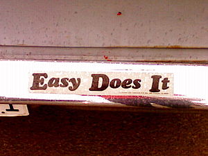 A bumper sticker on a car reading "Easy D...