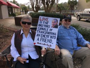 couple holding MLK love sign