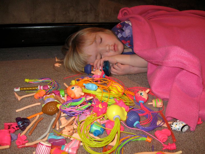 little girl with toys