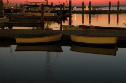 boats in harbor at sunset