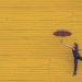 woman dancing with umbrella looks free