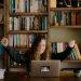 woman in black long sleeve shirt sitting in front of silver macbook