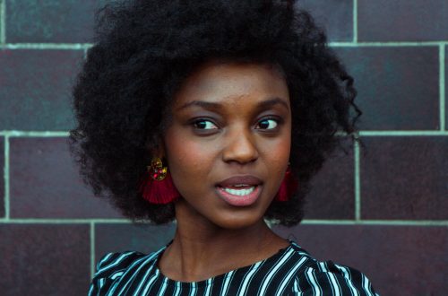 woman wearing black and green top