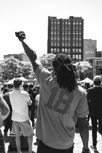 Back of African-American with fist raised