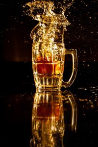 clear glass mug with brown liquid