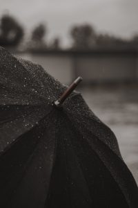 black umbrella with red handle