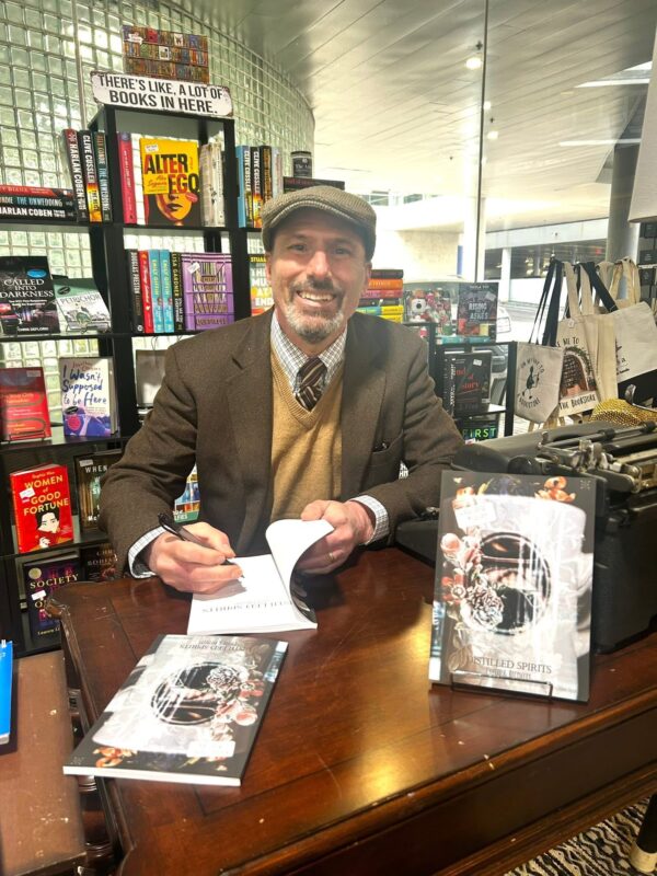 Author Robert Piazza signing his book of poetry